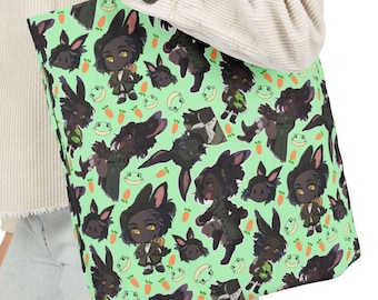 May include: A green tote bag with a black handle. The bag features a repeating pattern of cartoon black rabbits with green eyes and carrots, and green frogs with black eyes.