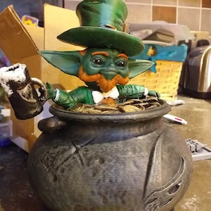 Green child leprechaun figure