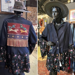 May include: A denim jacket with a floral print lining and a fringe trim. The jacket has a button closure and a collar.