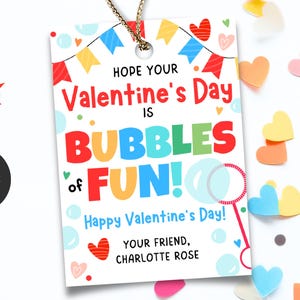 May include: A Valentine's Day gift tag with the message "Hope Your Valentine's Day Is Bubbles of Fun!" in colorful text. The tag includes a bubble wand graphic and is decorated with hearts and confetti.