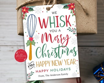 May include: A white Christmas gift tag with a red and green floral design. The tag features a whisk and the text "We whisk you a Merry Christmas and a Happy New Year. Happy Holidays. From, The Anderson Family."