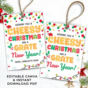 May include: Two Christmas gift tags with the text "Wishing you a Cheesy Christmas and a Grate New Year!" in colorful lettering. The tags have gold string and are decorated with festive elements.