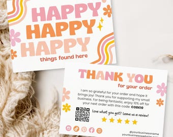 May include: Two white cards with the words "HAPPY HAPPY HAPPY" in pink and orange, with floral and rainbow designs. The second card says "THANK YOU for your order" with a QR code and social media icons. The cards are on a textured surface.