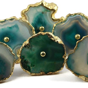 May include: Six green and white agate drawer pulls with gold trim. Each pull has a small gold knob in the center.