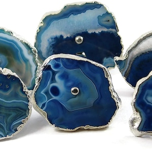 May include: Six blue agate drawer pulls with silver trim. Each pull has a unique pattern of blue and white agate.