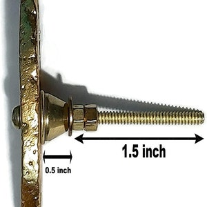 May include: Gold-toned metal cabinet knob with a 0.5 inch diameter and a 1.5 inch long screw.