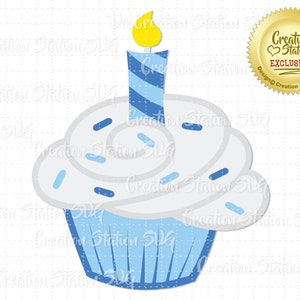 May include: A blue and white cupcake with white frosting and blue sprinkles. A yellow and blue striped candle sits on top of the cupcake.