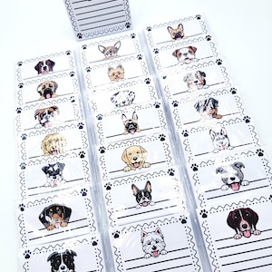 May include: A collection of rectangular white note cards featuring various dog breed illustrations at the top, each with a decorative border of wavy lines and paw prints, and horizontal black lines for writing below the dog graphic.