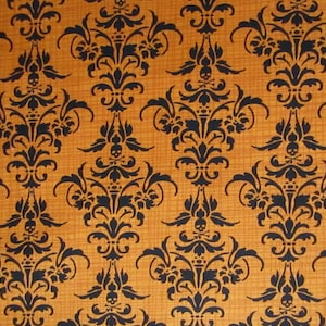 May include: A seamless fabric with a repeating pattern of black damask designs on an orange background. The damask designs feature a skull and crossbones motif.