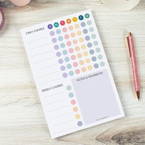 May include: A printable daily and weekly chore planner with a colorful dot grid for tracking tasks. The planner has sections for daily chores, weekly chores, and notes and reminders.