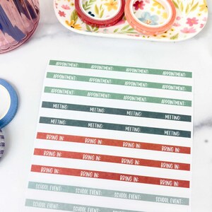 May include: A rectangular sticker sheet featuring rows of labels with text. The labels are organized by color: light green with "APPOINTMENT:", dark green with "MEETING:", terracotta with "BRING IN:", and sage green with "SCHOOL EVENT:" printed in white.