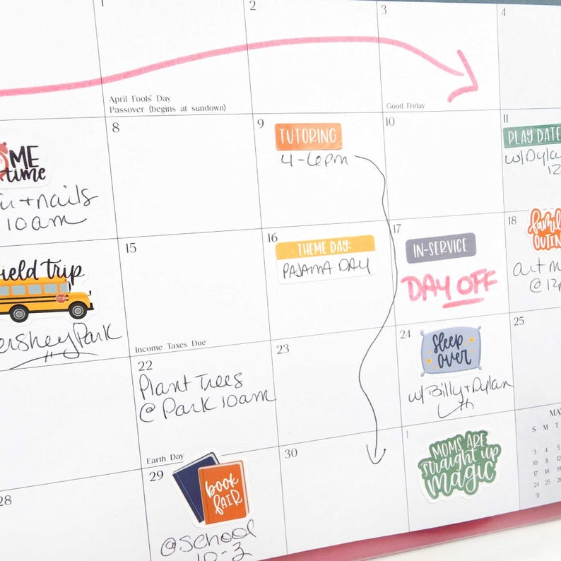 May include: A monthly wall calendar featuring various colorful stickers and handwritten notes. The grid includes labels like Tutoring, Theme Day: Pajama Day, In-Service Day Off, Sleep Over, and Book Fair, alongside a yellow school bus illustration.