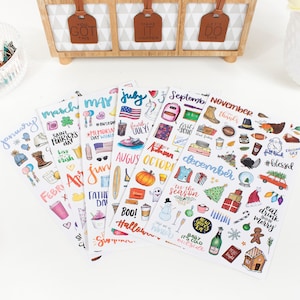 May include: A set of 12 monthly sticker sheets featuring colorful illustrations and handwritten text. Each sheet includes various stickers representing holidays and events for each month of the year. The stickers are perfect for planners, journals, and other creative projects.