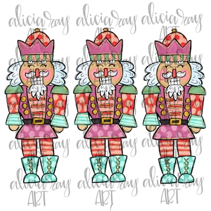 May include: Three festive nutcracker figurines with pink, red and green accents. Each nutcracker has a white beard, a gold belt and blue boots. The nutcrackers are standing on a white background.