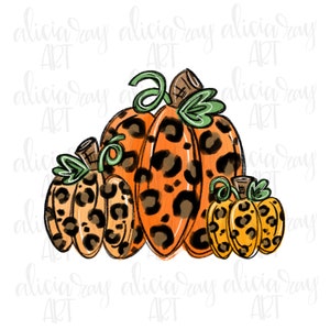 May include: Three pumpkins with a leopard print design. The pumpkins are orange and brown with green stems. The largest pumpkin is in the centre and the two smaller pumpkins are on either side.