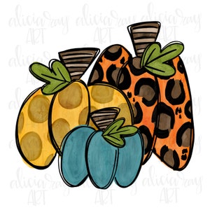 May include: Three pumpkins, one with a leopard print pattern, one with yellow polka dots, and one with a teal blue color. The pumpkins are arranged in a cluster, with the leopard print pumpkin in the back and the teal blue pumpkin in the front.