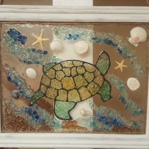 Handcrafted crushed glass sea turtle with shells & acrylic coating, framed 15x12