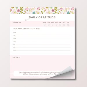 May include: A Daily Gratitude notepad with a floral design at the top. The notepad has sections for the week, days of the week, and space to write what you are grateful for. A quote is at the bottom.