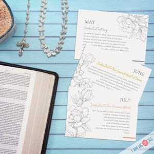 May include: Three printable cards with floral designs and text dedicated to Mary, the Sacred Heart of Jesus, and the Precious Blood. The cards are in black and white with a light blue background. The text on the cards is in black and white.