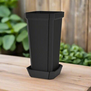 May include: A black plastic planter with a square base and a rectangular body. The planter has a textured surface and a matching saucer.