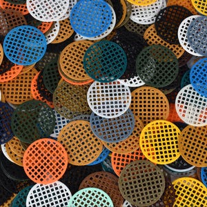 May include: Assortment of colorful plastic mesh circles, ideal for crafting projects. The circles come in a variety of colors, including blue, green, yellow, orange, red, white, and black.
