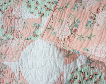 Sweet Pink Baby Girl Quilt with flowers and polka dots, both modern and traditional