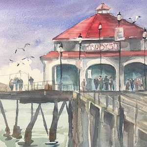May include: Watercolor painting of Ruby's, a restaurant on a pier. The building has a red roof and white walls. People are visible on the pier and inside the restaurant. Seagulls fly in the sky above the pier.