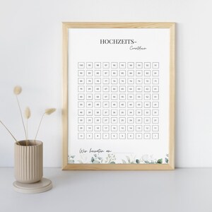 Pode incluir: Um gr&aacute;fico de contagem regressiva para casamento imprim&iacute;vel com uma borda floral. O gr&aacute;fico apresenta os n&uacute;meros de 1 a 100, com um espa&ccedil;o em branco na parte inferior para a data do casamento.