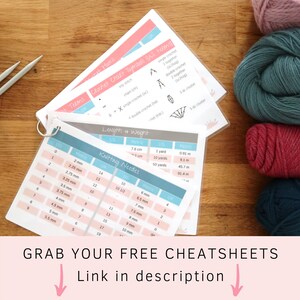 May include: Close-up of two printable crochet and knitting cheat sheets with color-coded charts and symbols. The cheat sheets include US and metric measurements for yarn weight and knitting needle sizes. The text on the cheat sheets reads "Crochet Chart Symbols (US terms)" and "Knitting Needles".