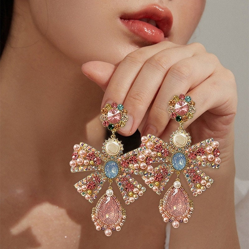 Vintage Chanel stud earrings pink ribbon rhinestone dangle