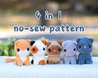 May include: Four crocheted cat amigurumi toys in different colors: orange, white with orange spots, brown, and blue. The toys are sitting on a white and gray knitted blanket. The text "4 in 1 no-sew pattern" is above the toys.