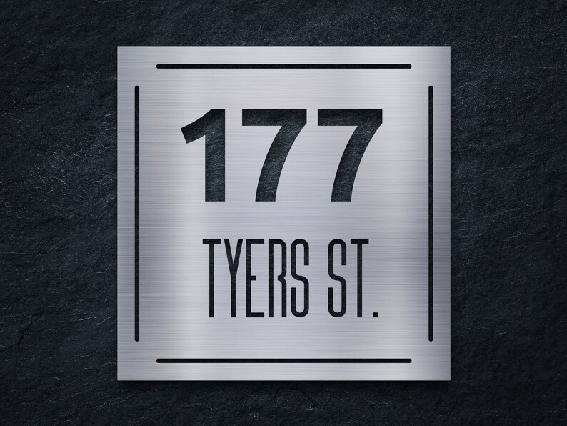 May include: A silver metal house number sign with the number 177 and the street name "TYERS ST." in black lettering.