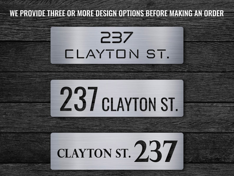 May include: Three different design options for a house number sign. The sign is made of brushed metal and features the address "237 Clayton St.".