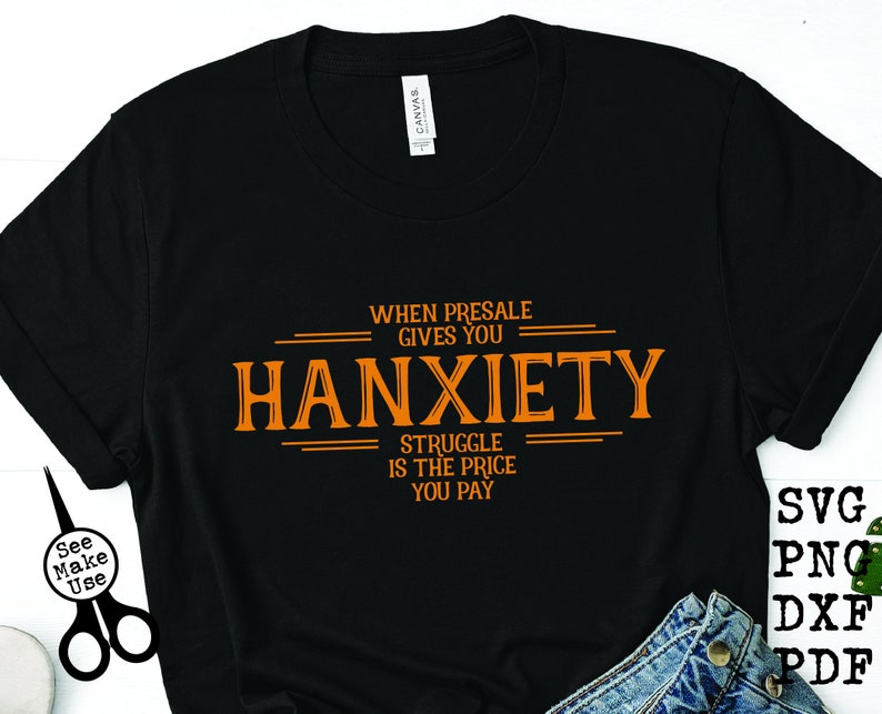May include: Black t-shirt with orange text that reads "When presale gives you hanxiety, struggle is the price you pay".