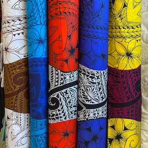 May include: Rolled fabric bolts with vibrant floral and tribal designs. Colors include white, brown, blue, red, black, and yellow. The fabric features large flower patterns and intricate geometric tribal motifs, suitable for various crafting projects.