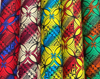 May include: Four rolls of fabric with a repeating geometric pattern in shades of red, yellow, blue, and green. The pattern features a stylized flower design.