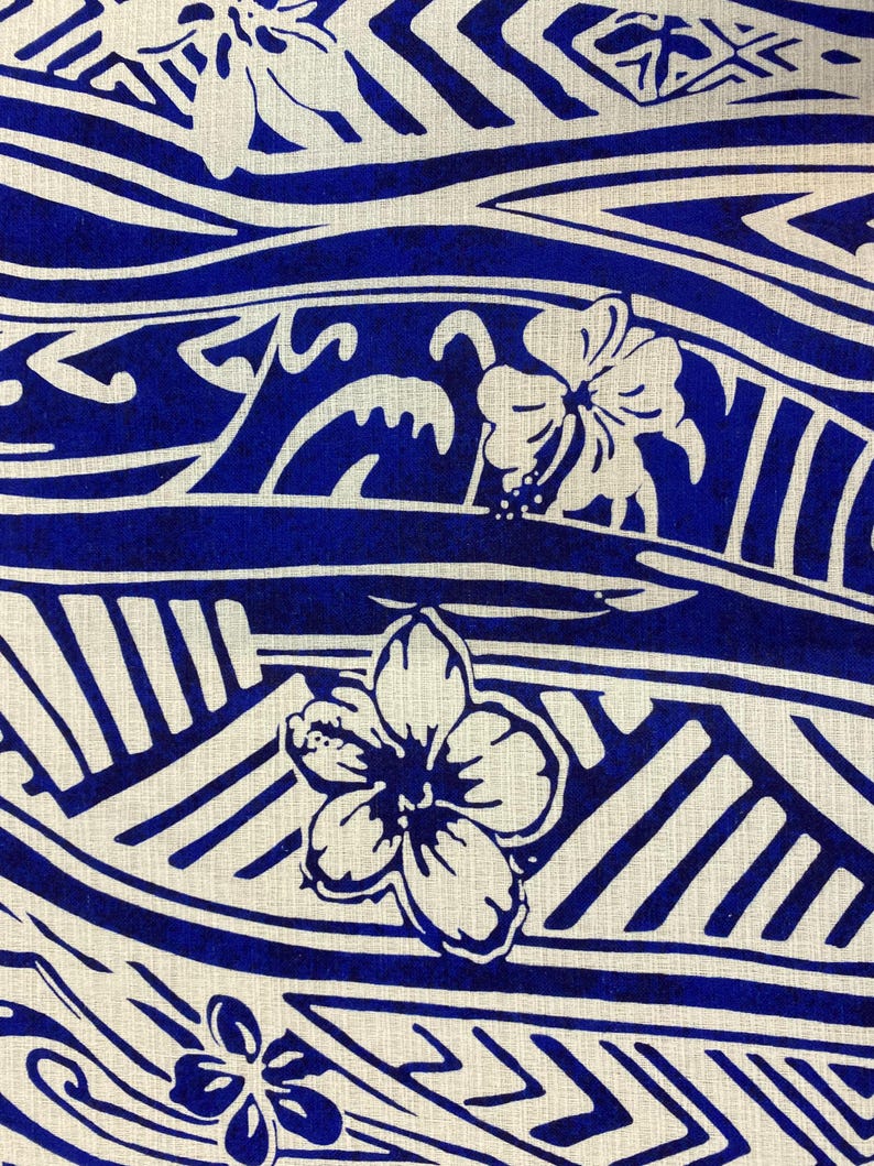 May include: Blue and white fabric with a repeating pattern of stylized flowers and geometric shapes. The fabric has a linen texture.
