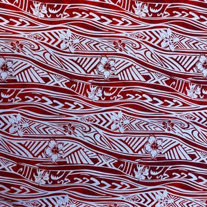 May include: Red and white fabric with a repeating pattern of waves and flowers. The waves are stylized and the flowers are simple.
