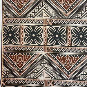 May include: Close-up of a fabric with a repeating geometric pattern. The design features black, brown, and white shapes, including triangles, floral motifs, and linear elements. The fabric has a cream-colored background and a yellow border.