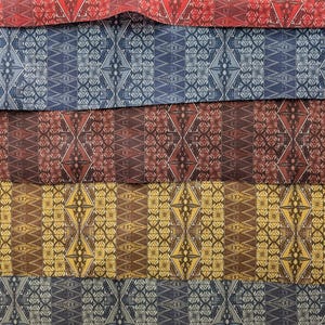 May include: Five fabric swatches with geometric patterns in red, blue, brown, yellow, and gray. The patterns are symmetrical and feature repeating shapes.