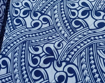May include: Close-up of a fabric with a repeating pattern in white and navy blue. The design features curved lines, swirls, and geometric shapes, creating a bold and intricate visual texture. The fabric appears to be folded.