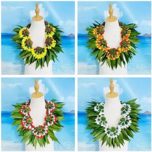 May include: Four leis made of green leaves and colorful flowers. The leis are arranged in a square pattern, with each lei centered on a white mannequin head. The leis are all different colors, with one being yellow and orange, one being red and orange, one being white and green, and one being red and green.