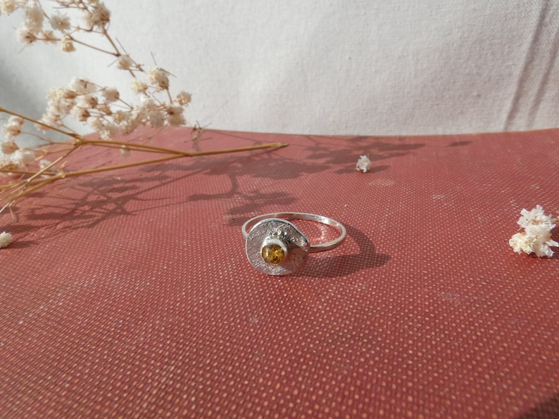 Silver ring set with amber