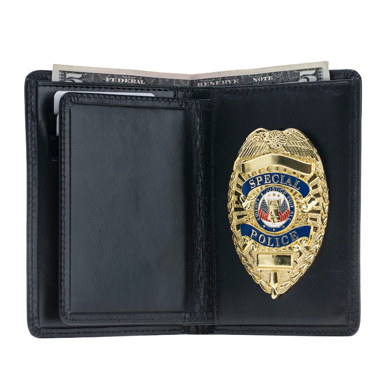May include: Black leather wallet with a gold-colored Special Police badge. The badge has blue and red accents. A few dollar bills are visible inside the open wallet.