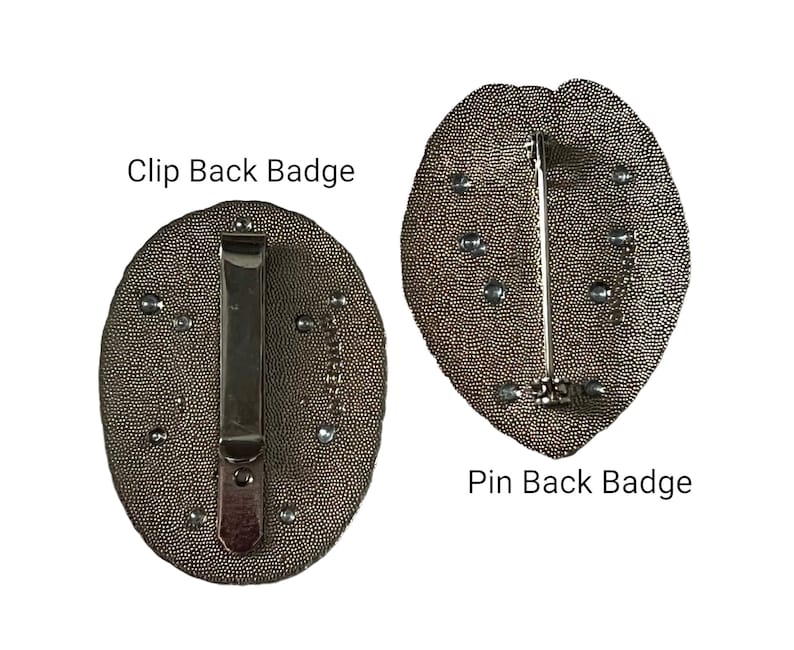 May include: Two badges with textured, oval-shaped faces. One has a clip back, the other a pin back. Both are a dark, metallic color with small, silver-colored accents. Text on the image reads "Clip Back Badge" and "Pin Back Badge".