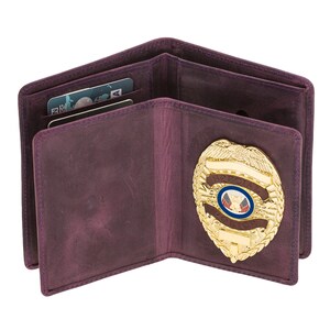 May include: Open purple leather wallet with a gold badge. The wallet has multiple card slots and a clear ID window. The badge is gold with a blue and red emblem and the words "SPECIAL POLICE".