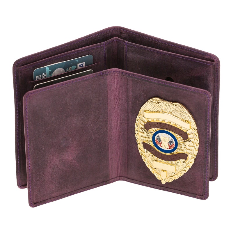 May include: Open purple leather wallet with a gold badge. The wallet has multiple card slots and a clear ID window. The badge is gold with a blue and red emblem and the words "SPECIAL POLICE".