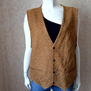 May include: A white ceramic mug with a black handle and the text "But First, Coffee" in a bold, black font. The mug is set against a neutral background, highlighting its simple design.