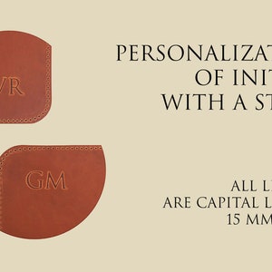 May include: Two brown leather corner bookmarks with initials "AVR" and "GM" embossed in gold. The bookmarks are 15 mm high. Free personalization of initials with a stamp.