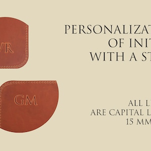 May include: Two brown leather corner bookmarks with initials "AVR" and "GM" embossed in gold. The text "FREE PERSONALIZATION OF INITIALS WITH A STAMP" and "ALL LETTERS ARE CAPITAL LETTERS 15 MM. HIGH" is also visible.